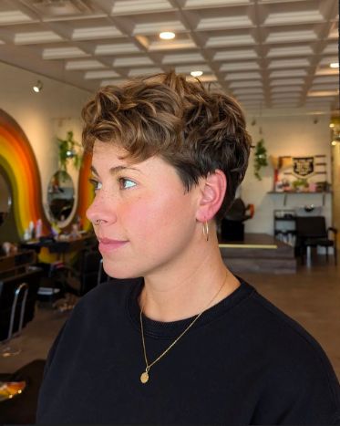 Client with a short textured curly crop with a faded undercut